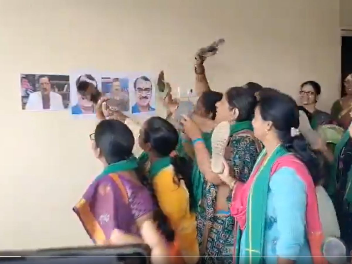 Women in the capital protested by hitting photos of witness representative Kommineni with sandals