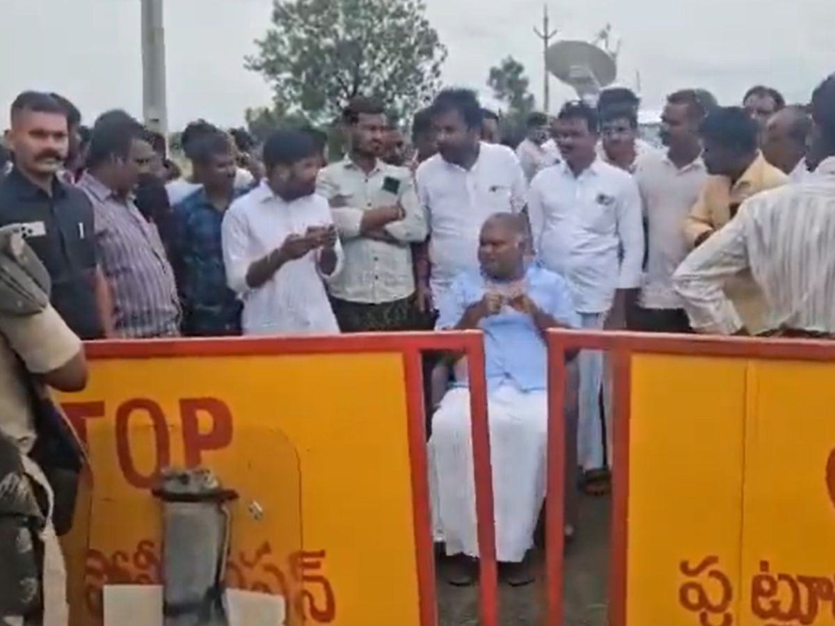 Pedda Reddy sitting on a chair at the edge of the Tadipatri